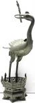 Pewter figure crane with wick holder in the beak and mobile wings(with be elastic soldered). Height 