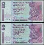 Standard Chartered Bank,a pair of $50, 1 July 1997 and 1 January 1998, serial number A243460 and U99