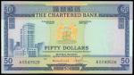 The Chartered Bank, $50, no date (1970-75), serial number A0049528, blue and multicoloured, coat of 