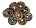 清代钱币一组九枚，其中包括咸丰重宝当五十二枚，咸丰元宝当百五枚，山鬼咒花钱二枚，直径：42毫米-56毫米，极美品