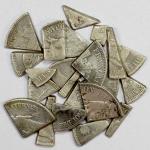Group Lots - World Coins. MADAGASCAR: LOT of 23 cut pieces of vakimbola, of 19th-century French 5 fr