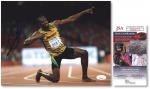 牙买加著名短跑运动员、三届奥运冠军“尤塞恩·博尔特”十寸亲笔签名照片一件，世界著名鉴定机构JSA认证