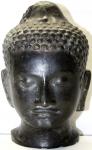 Cast brass Buddha head. Hollow, from 2 Langshalften joinedtogether. Height 24 cm. Dark patinated, de