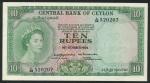 x Central Bank of Ceylon, 10 rupees, 16th October 1954, serial number L/38 520207, green and purple 